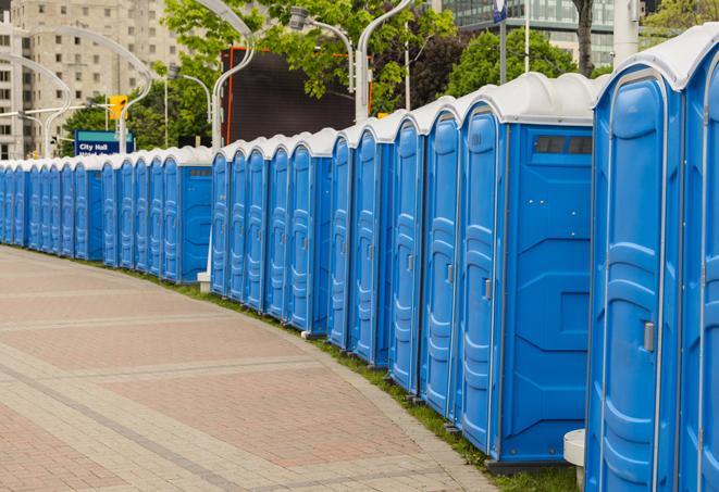 a row of portable restrooms set up for a large athletic event, allowing participants and spectators to easily take care of their needs in Boulder CO